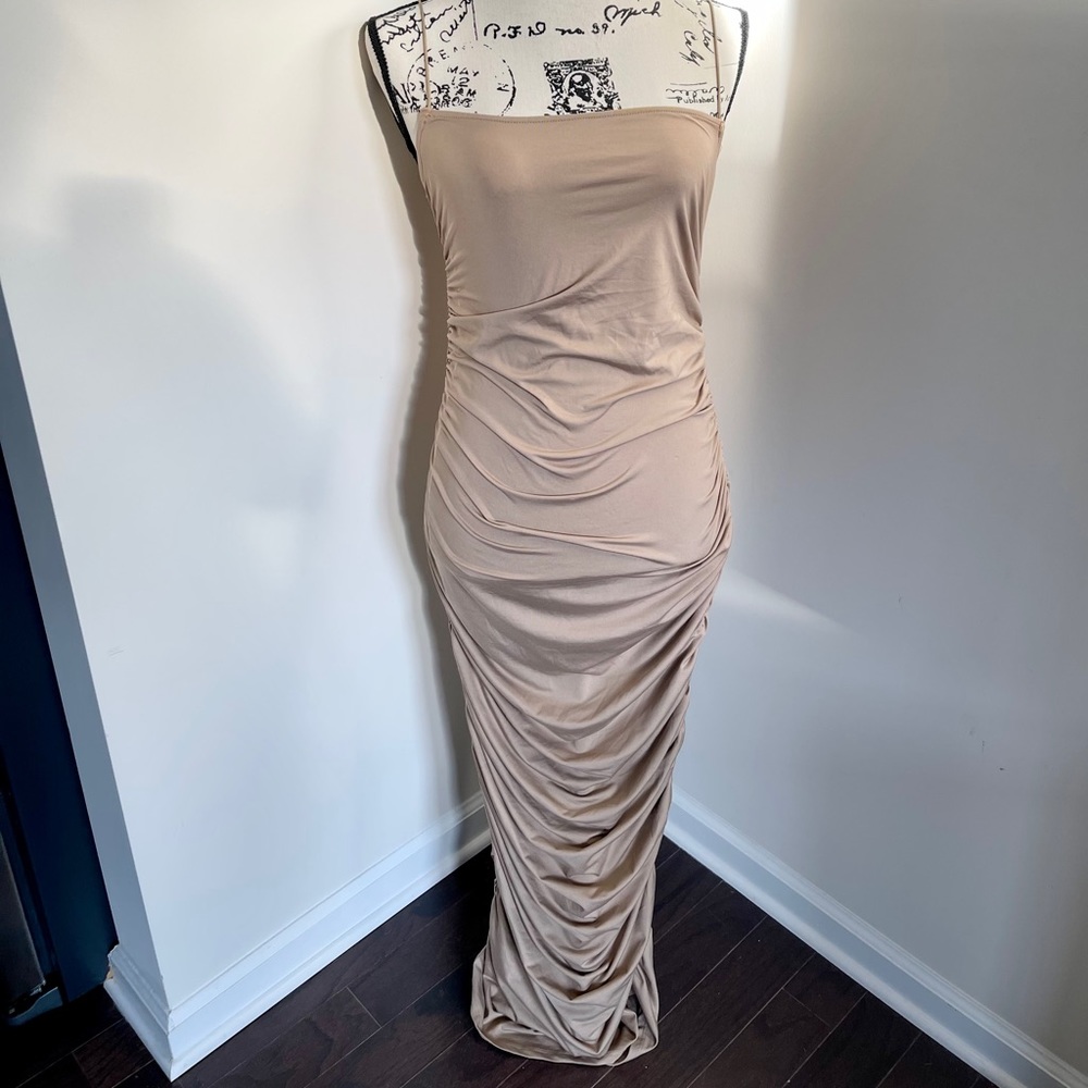 A tan spaghetti strap bodycon dress by Bear Dance.